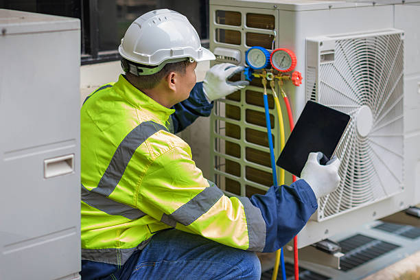 Professional Heat Pump Repair technician working in North Pembroke, MA